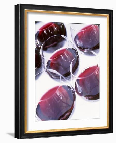 Six Glasses of Red Wine Against White Background-Linda Burgess-Framed Photographic Print