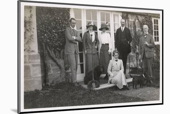 Six People with Two Dogs in a Garden-null-Mounted Photographic Print