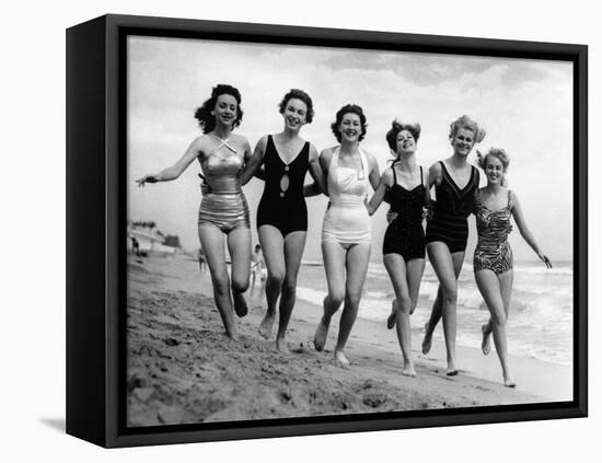 Six Women, in Swimsuits, Run in a Row Along a Beach, 1942-null-Framed Premier Image Canvas