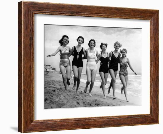 Six Women, in Swimsuits, Run in a Row Along a Beach, 1942-null-Framed Photographic Print