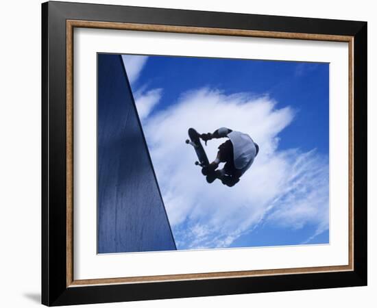 Skateboarder in Action over the Vert-null-Framed Photographic Print