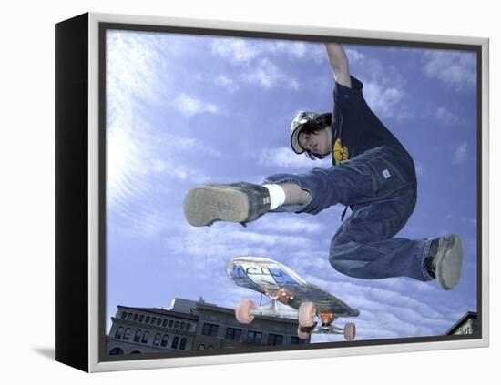 Skateboarder in Midair Doing a Trick-null-Framed Premier Image Canvas