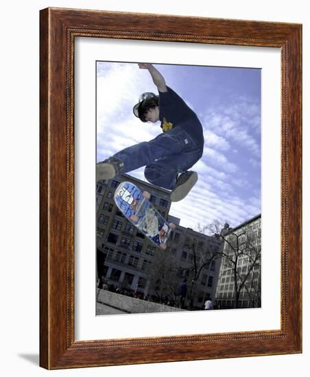 Skateboarder in Midair Doing a Trick-null-Framed Photographic Print