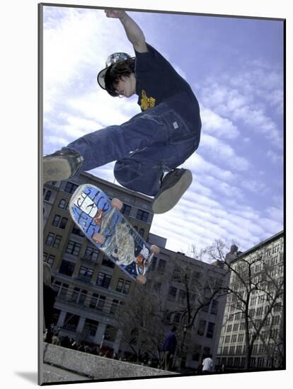 Skateboarder in Midair Doing a Trick-null-Mounted Photographic Print