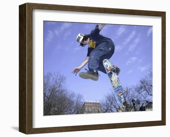 Skateboarder in Midair Doing a Trick-null-Framed Photographic Print