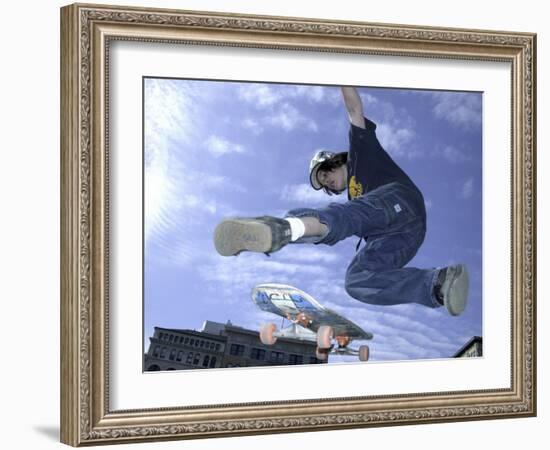 Skateboarder in Midair Doing a Trick-null-Framed Photographic Print