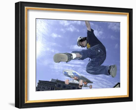 Skateboarder in Midair Doing a Trick-null-Framed Photographic Print