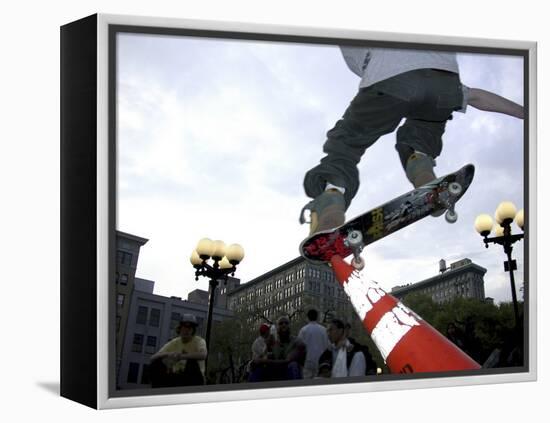 Skateboarder in Midair Knocking Over a Cone-null-Framed Premier Image Canvas