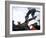 Skateboarder in Midair Knocking Over a Cone-null-Framed Photographic Print