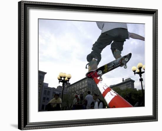 Skateboarder in Midair Knocking Over a Cone-null-Framed Photographic Print