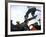 Skateboarder in Midair Knocking Over a Cone-null-Framed Photographic Print