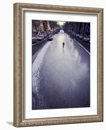 Skater on Frozen Canal, Amsterdam, Netherlands-Michele Molinari-Framed Photographic Print