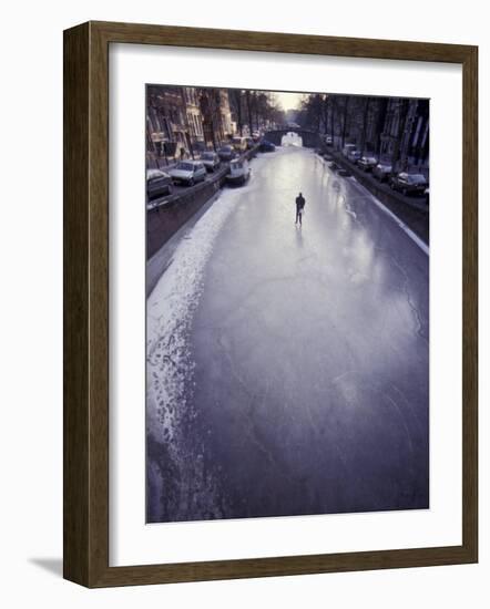 Skater on Frozen Canal, Amsterdam, Netherlands-Michele Molinari-Framed Photographic Print