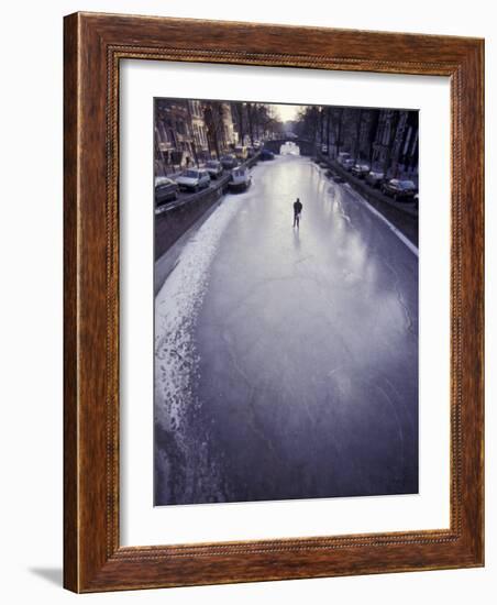 Skater on Frozen Canal, Amsterdam, Netherlands-Michele Molinari-Framed Photographic Print