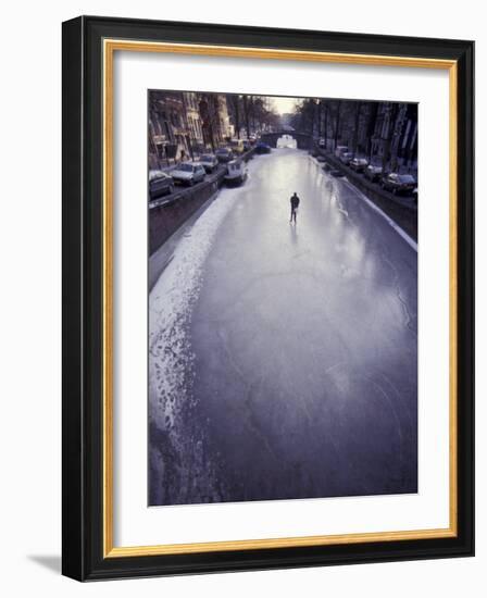 Skater on Frozen Canal, Amsterdam, Netherlands-Michele Molinari-Framed Photographic Print