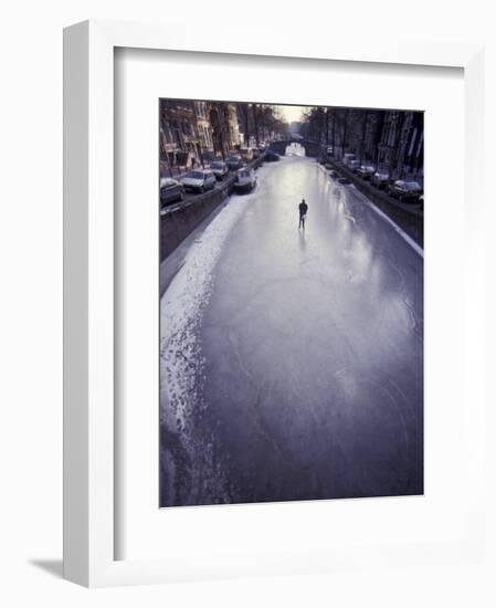 Skater on Frozen Canal, Amsterdam, Netherlands-Michele Molinari-Framed Photographic Print