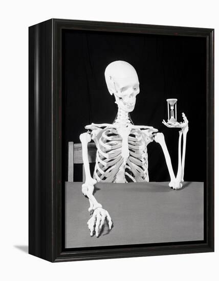 Skeleton Holding Hourglass-Bettmann-Framed Premier Image Canvas