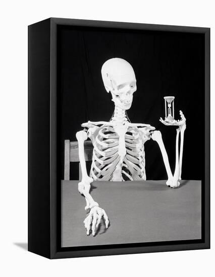 Skeleton Holding Hourglass-Bettmann-Framed Premier Image Canvas