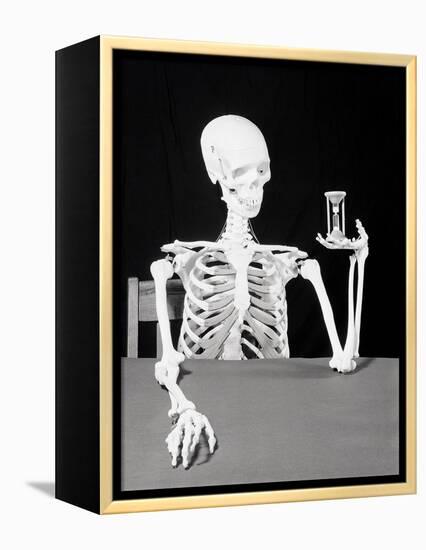 Skeleton Holding Hourglass-Bettmann-Framed Premier Image Canvas