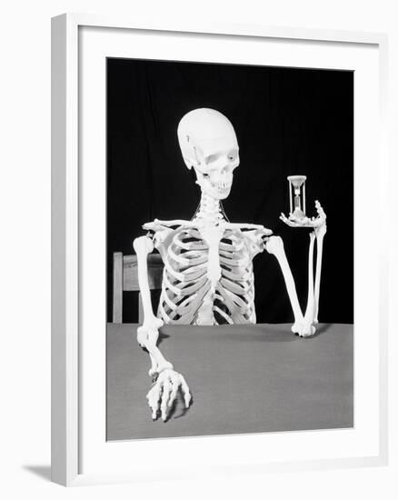 Skeleton Holding Hourglass-Bettmann-Framed Photographic Print