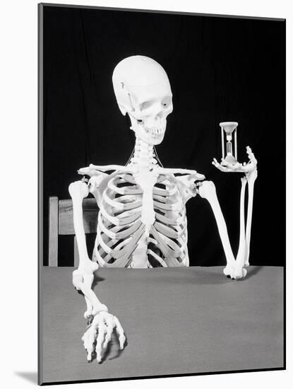 Skeleton Holding Hourglass-Bettmann-Mounted Photographic Print