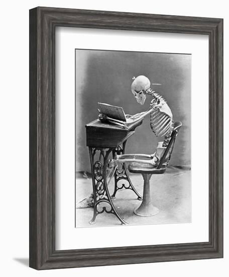 Skeleton Reading at Desk-Bettmann-Framed Photographic Print