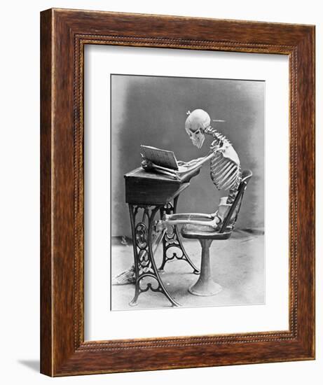 Skeleton Reading at Desk-Bettmann-Framed Photographic Print