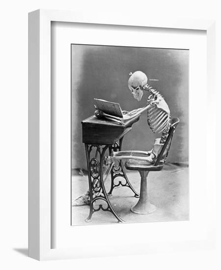 Skeleton Reading at Desk-Bettmann-Framed Photographic Print