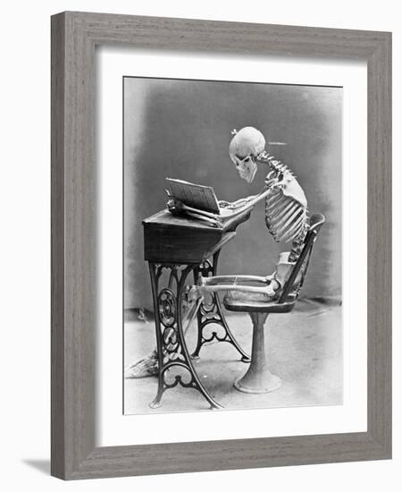 Skeleton Reading at Desk-Bettmann-Framed Photographic Print