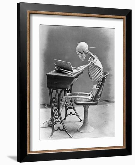 Skeleton Reading at Desk-Bettmann-Framed Photographic Print