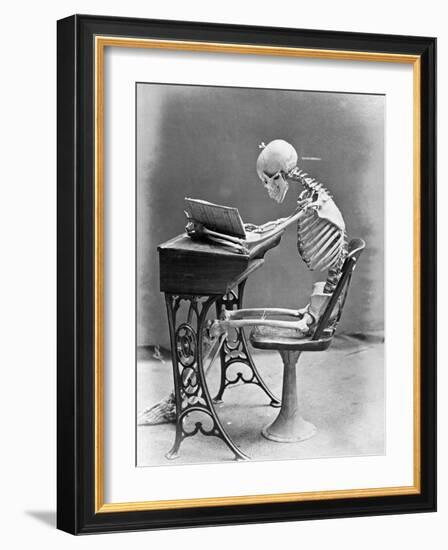 Skeleton Reading at Desk-Bettmann-Framed Photographic Print