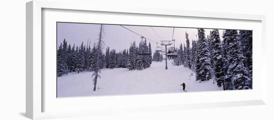 Ski Lift Passing over a Snow Covered Landscape, Keystone Resort, Keystone, Colorado, USA-null-Framed Photographic Print