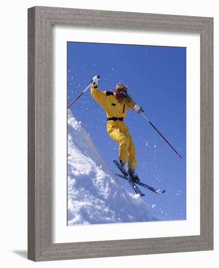 Skier in Yellow Against a Blue Sky-null-Framed Photographic Print