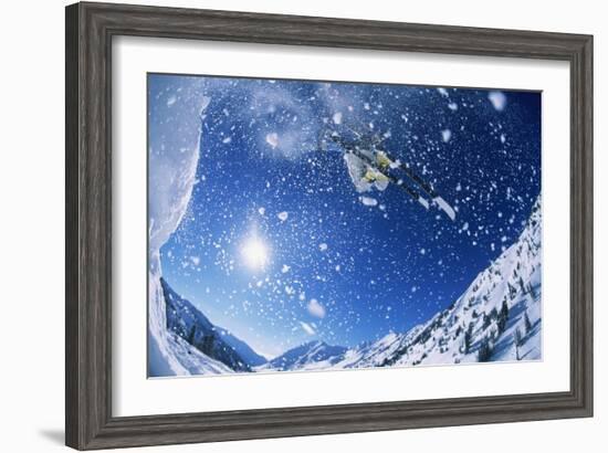 Skier Jumping from Mountain Ledge-null-Framed Photo