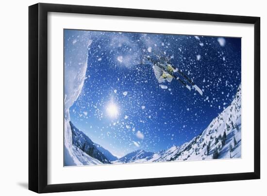 Skier Jumping from Mountain Ledge-null-Framed Photo