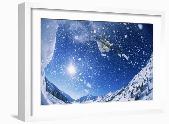 Skier Jumping from Mountain Ledge-null-Framed Photo