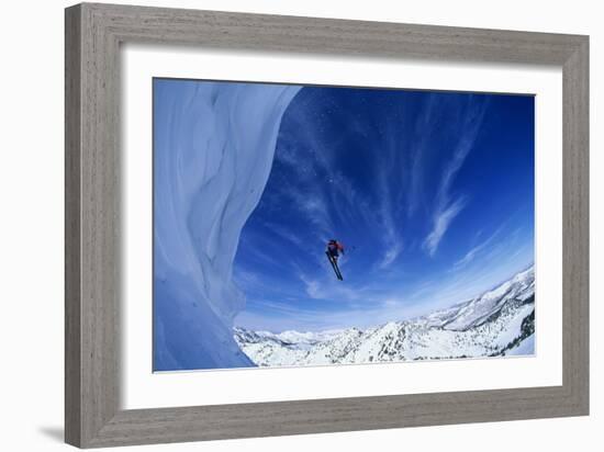 Skier Jumping from Mountain Ledge-null-Framed Photo