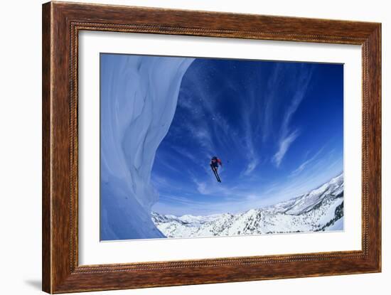 Skier Jumping from Mountain Ledge-null-Framed Photo