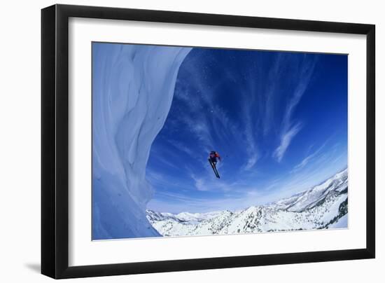 Skier Jumping from Mountain Ledge-null-Framed Photo