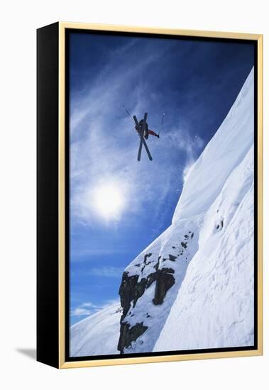 Skier Jumping from Mountain Ledge-null-Framed Stretched Canvas