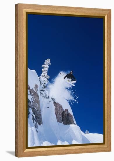 Skier Jumping from Mountain Ledge-null-Framed Stretched Canvas