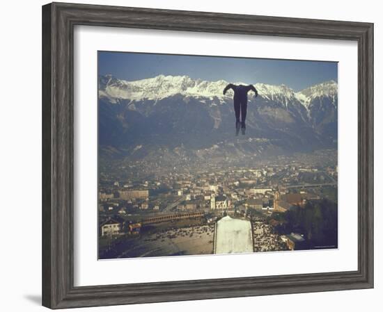 Skier Taking Off from the Bergisel Jump Hangs During Innsbruck Winter Olympics Competition-Ralph Crane-Framed Photographic Print