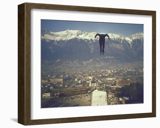 Skier Taking Off from the Bergisel Jump Hangs During Innsbruck Winter Olympics Competition-Ralph Crane-Framed Photographic Print