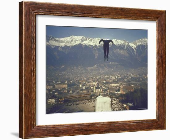 Skier Taking Off from the Bergisel Jump Hangs During Innsbruck Winter Olympics Competition-Ralph Crane-Framed Photographic Print