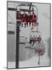 Skiers and Snowboarders Dressed as Santa Claus Ride up the Ski Lift-null-Mounted Photographic Print