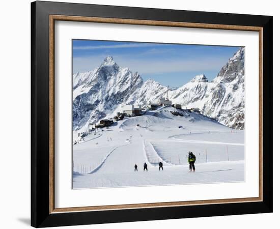 Skiers, Mountain Scenery in Cervinia Ski Resort, Cervinia, Valle D'Aosta, Italian Alps, Italy-Christian Kober-Framed Photographic Print