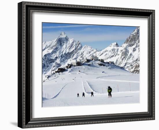 Skiers, Mountain Scenery in Cervinia Ski Resort, Cervinia, Valle D'Aosta, Italian Alps, Italy-Christian Kober-Framed Photographic Print