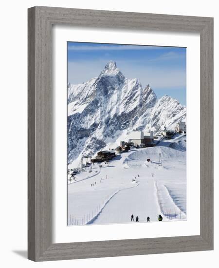 Skiers, Mountain Scenery in Cervinia Ski Resort, Cervinia, Valle D'Aosta, Italian Alps, Italy-Christian Kober-Framed Photographic Print