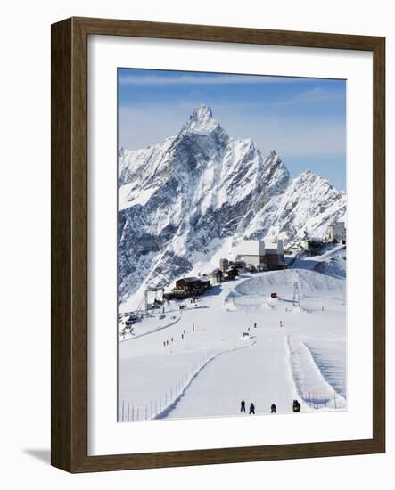 Skiers, Mountain Scenery in Cervinia Ski Resort, Cervinia, Valle D'Aosta, Italian Alps, Italy-Christian Kober-Framed Photographic Print