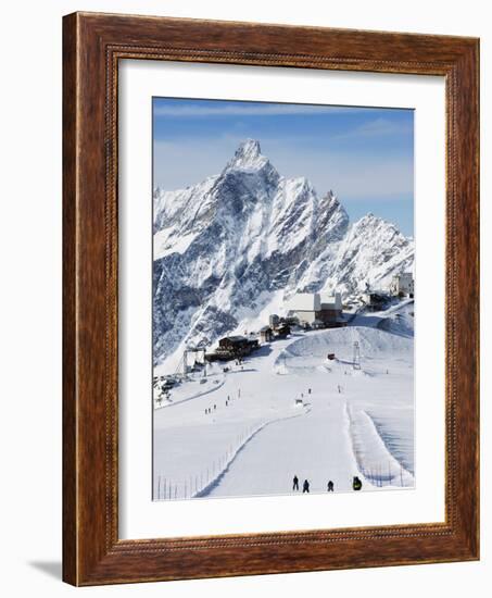 Skiers, Mountain Scenery in Cervinia Ski Resort, Cervinia, Valle D'Aosta, Italian Alps, Italy-Christian Kober-Framed Photographic Print